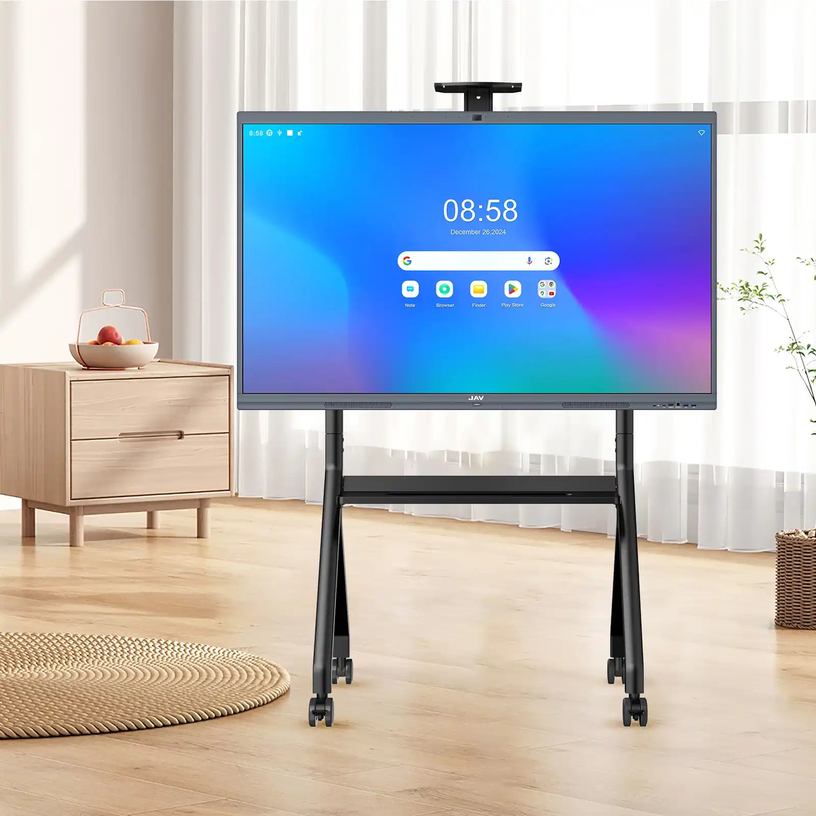 JAV H10 Pro interactive display on a mobile rolling stand showing its home screen interface within a modern bedroom setting.
