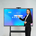 Presenter demonstrating the home screen interface of a JAV H10S Pro interactive display mounted on a mobile stand.