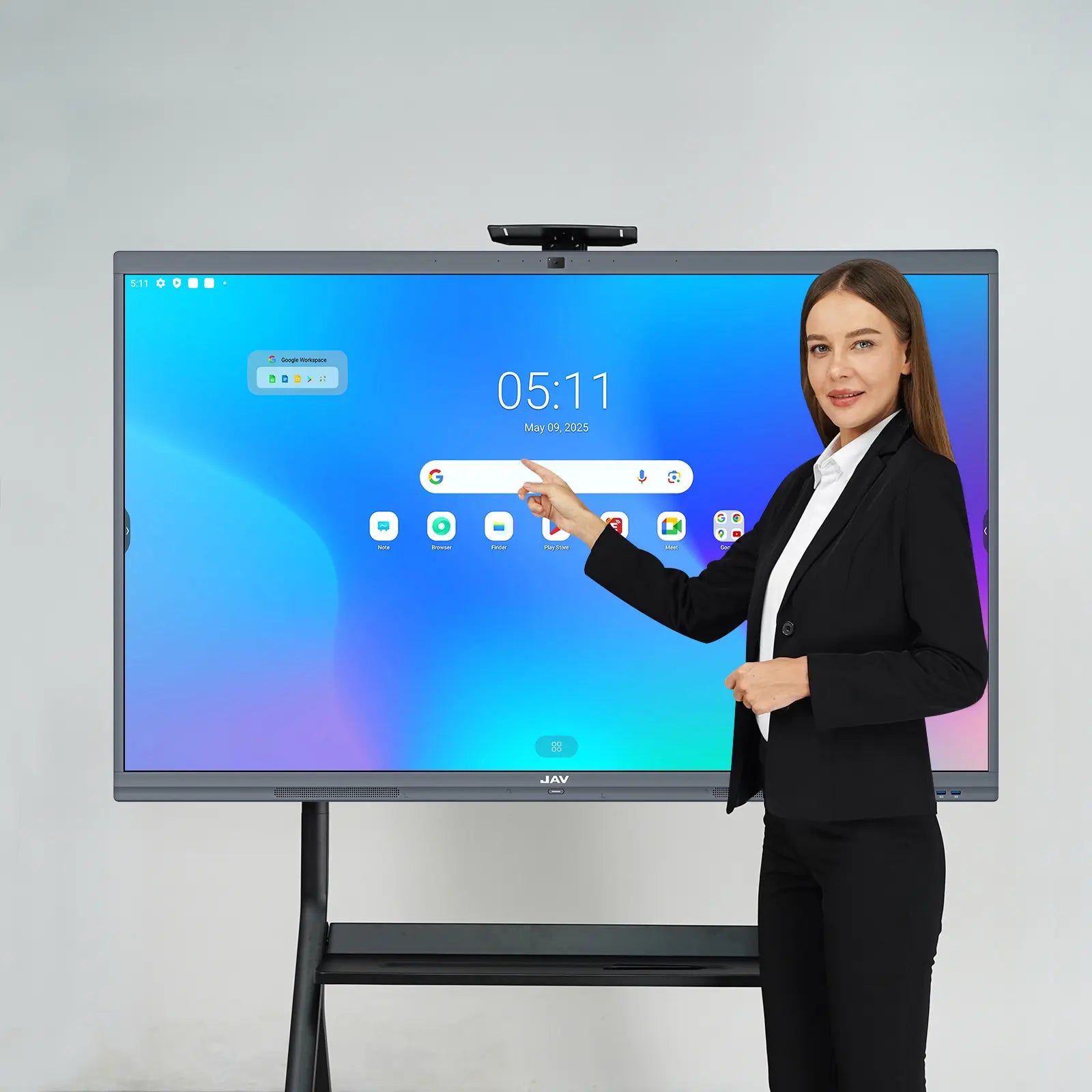 Presenter demonstrating the home screen interface of a JAV H10S Pro interactive display mounted on a mobile stand.