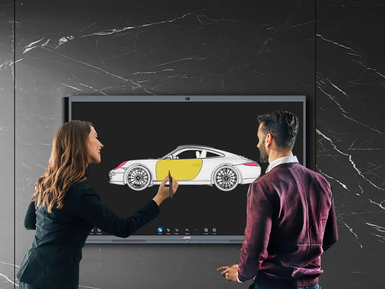 Woman uses a stylus to edit or annotate a car design displayed on a large JAV interactive whiteboard while a colleague observes.