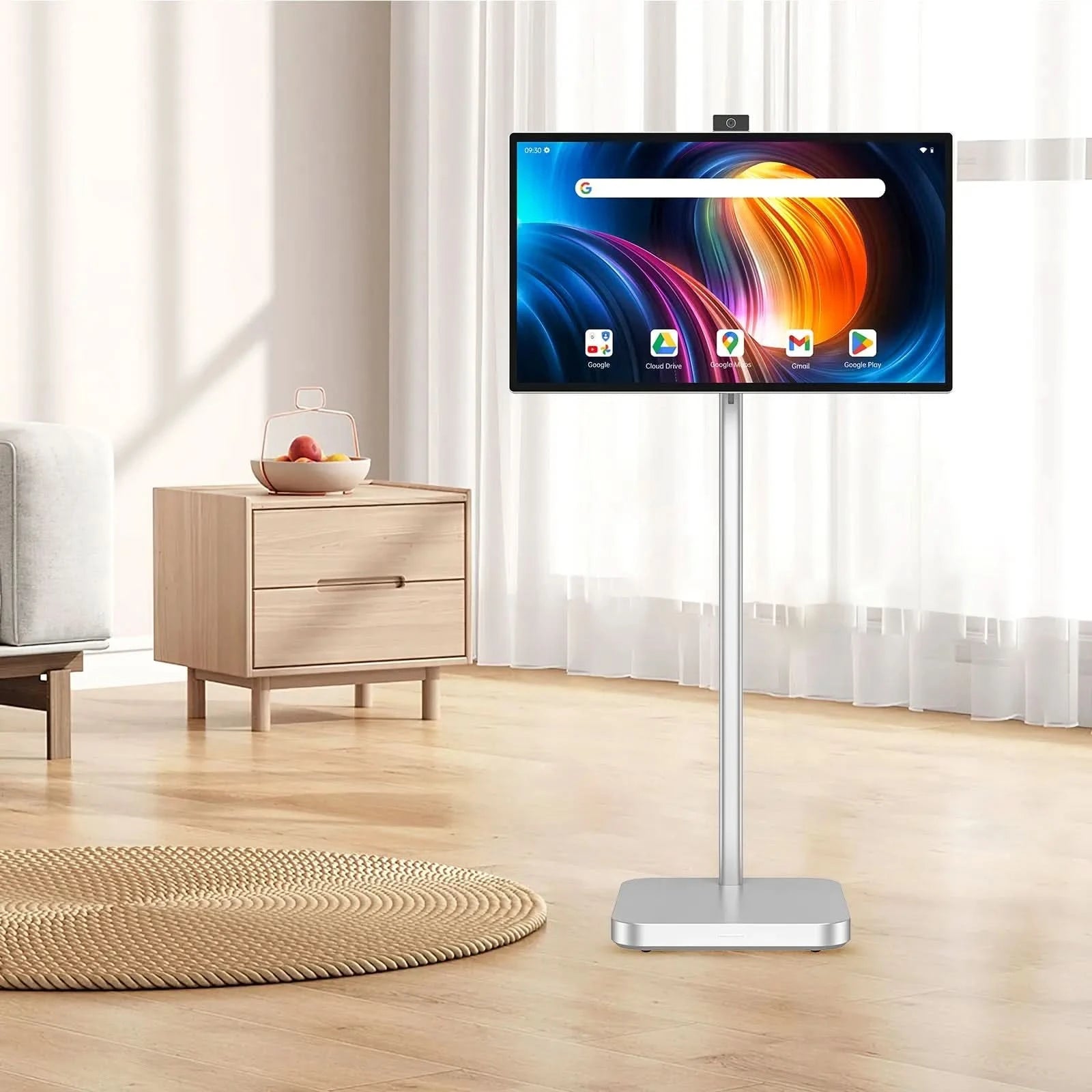 JAV Rolling Tablet LED 32S for live stream in a home setting. Features app icons like Google, Cloud Drive, Mail, Play Store, and a visible clock, with cabinet and curtains in background.