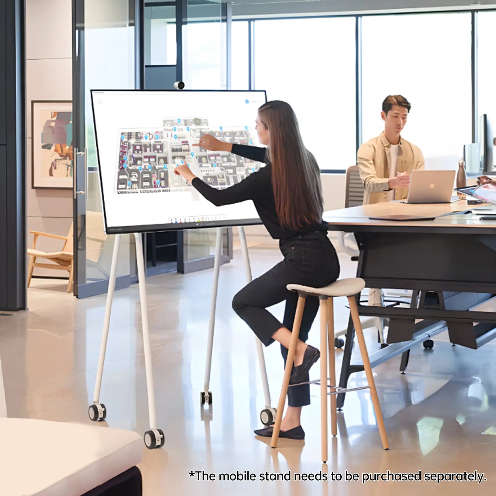 Person interacting with JAV interactive smart board displaying a diagram. Enhancing learning and presentations.
