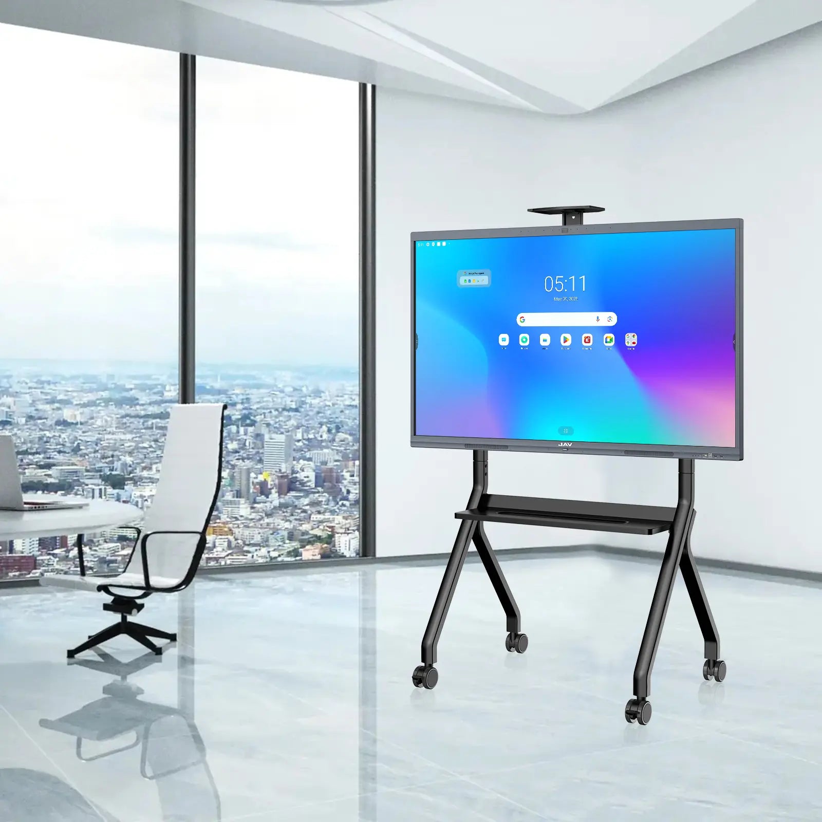 JAV H10S Pro interactive whiteboard positioned on a mobile rolling stand within a bright, modern high-rise office setting.